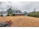 Spacious backyard, partially covered in leaves at 4685 Ruby Ln, Forest Park, GA 30297