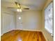 Bedroom with hardwood floors, door and ceiling fan at 4685 Ruby Ln, Forest Park, GA 30297