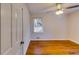 Hardwood floor bedroom with ceiling fan and window at 4685 Ruby Ln, Forest Park, GA 30297