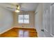 Bright bedroom with hardwood floors and ceiling fan at 4685 Ruby Ln, Forest Park, GA 30297