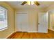 Bedroom with hardwood floors, double closet and ceiling fan at 4685 Ruby Ln, Forest Park, GA 30297