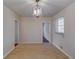 Dining room featuring light walls and a chandelier at 4685 Ruby Ln, Forest Park, GA 30297