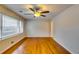 Hardwood floors and ceiling fan in bright living room at 4685 Ruby Ln, Forest Park, GA 30297