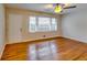 Hardwood floor living room with large window and door at 4685 Ruby Ln, Forest Park, GA 30297