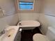 Bathroom with clawfoot tub, sink, and toilet at 2069 Bixler Cir, Decatur, GA 30032