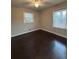 Bright bedroom with hardwood floors and two windows at 2069 Bixler Cir, Decatur, GA 30032