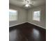 Spacious bedroom with dark hardwood floors and ceiling fan at 2069 Bixler Cir, Decatur, GA 30032