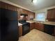 Kitchen with wood cabinets, tile floor, and appliances at 2069 Bixler Cir, Decatur, GA 30032