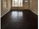 Living room with dark hardwood floors and large windows at 2069 Bixler Cir, Decatur, GA 30032