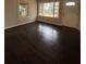 Living room with dark hardwood floors and large windows at 2069 Bixler Cir, Decatur, GA 30032