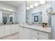 Bright bathroom with granite countertops, dual sinks, and lots of mirror and cabinet space at 3101 Howell Mill Nw Rd # 327, Atlanta, GA 30327