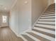 Staircase and entryway with hardwood floors at 200 Dahlia Dr, Woodstock, GA 30188