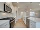 Modern kitchen with stainless steel appliances and white cabinets at 200 Dahlia Dr, Woodstock, GA 30188