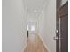 Inviting hallway with neutral walls, wood floors, recessed lighting leading to the main living area at 913 Agate Ln, Lawrenceville, GA 30043