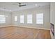 Open-concept living room with wood floors, stylish lighting and modern fireplace at 913 Agate Ln, Lawrenceville, GA 30043