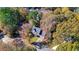 Aerial view of home with lush landscaping in the Autumn at 4511 Balmoral Nw Rd, Kennesaw, GA 30144