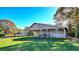 A large barn with an open-air shelter sits on a grassy field with trees on a sunny day at 4511 Balmoral Nw Rd, Kennesaw, GA 30144