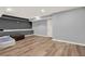 Basement featuring gray walls and hardwood floors is ready to be made into a customizable space at 4511 Balmoral Nw Rd, Kennesaw, GA 30144