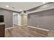 The finished basement has hardwood floors with entryways to additional rooms for versatility at 4511 Balmoral Nw Rd, Kennesaw, GA 30144