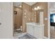 Bathroom featuring a large white vanity, framed decor, and view into the main bedroom at 4511 Balmoral Nw Rd, Kennesaw, GA 30144