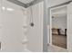 Walk-in shower in bathroom is adjacent to a bedroom with hardwood floors at 4511 Balmoral Nw Rd, Kennesaw, GA 30144