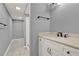 Bathroom featuring modern white cabinets, grey walls, sink, and a walk-in shower at 4511 Balmoral Nw Rd, Kennesaw, GA 30144