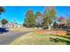 Attractive clubhouse entrance with manicured lawn and colorful floral display at 4511 Balmoral Nw Rd, Kennesaw, GA 30144