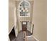 Grand two-story foyer with a large window, chandelier, and staircase offers a bright and elegant entrance at 4511 Balmoral Nw Rd, Kennesaw, GA 30144