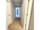 Carpeted hallway with multiple doorways at 4511 Balmoral Nw Rd, Kennesaw, GA 30144