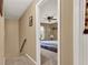 Hallway with an open doorway to a carpeted bedroom with a ceiling fan at 4511 Balmoral Nw Rd, Kennesaw, GA 30144