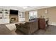 Relaxing living room with built-in shelves, a stone fireplace, and hardwood flooring at 4511 Balmoral Nw Rd, Kennesaw, GA 30144