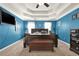 Spacious bedroom with a coffered ceiling, blue walls, and rich dark wood furniture at 4511 Balmoral Nw Rd, Kennesaw, GA 30144