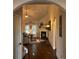 Open entryway with hardwood floors, arched doorway, and view of living room with fireplace at 1124 Kingston Hill Dr, Loganville, GA 30052