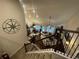 Bright living room featuring hardwood floors, fireplace, and abundant natural light from large windows at 1124 Kingston Hill Dr, Loganville, GA 30052