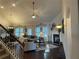 Inviting living room featuring hardwood floors, fireplace, and ample natural light from large windows at 1124 Kingston Hill Dr, Loganville, GA 30052