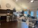 Open-concept living space featuring a modern kitchen with stainless steel appliances and a cozy living area at 1124 Kingston Hill Dr, Loganville, GA 30052