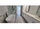 Spa-like bathroom showcasing a modern tub, walk-in shower, and double sink vanity for ultimate relaxation at 161 Brush Creek Ct, Stockbridge, GA 30281