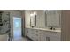 A luxurious bathroom complete with sleek vanity, black hardware, and a stunning walk-in shower at 161 Brush Creek Ct, Stockbridge, GA 30281