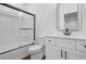 Clean bathroom featuring a shower-tub combo with glass doors and a modern vanity with a sleek faucet at 161 Brush Creek Ct, Stockbridge, GA 30281