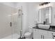 Modern bathroom with frameless glass shower, sleek vanity with vessel sink, and neutral decor at 161 Brush Creek Ct, Stockbridge, GA 30281