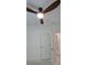 Bright bedroom with a lighted ceiling fan, doors, and a window with a view at 161 Brush Creek Ct, Stockbridge, GA 30281