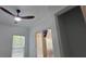 Bright room features a ceiling fan, light-filled window, and modern interior doors, ready for personalization at 161 Brush Creek Ct, Stockbridge, GA 30281