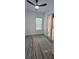 Inviting bedroom showcases new flooring, trim details, a ceiling fan, and a door to a private space at 161 Brush Creek Ct, Stockbridge, GA 30281