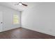 Bright bedroom with hardwood floors and a single window allowing in ample natural light at 161 Brush Creek Ct, Stockbridge, GA 30281
