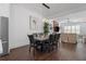 Dining room open to the living room and kitchen with hardwood floors and modern lighting at 161 Brush Creek Ct, Stockbridge, GA 30281