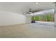 Expansive garage with an open overhead door, offering ample space and natural light at 161 Brush Creek Ct, Stockbridge, GA 30281