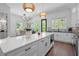 Updated kitchen with quartz countertop island, pendant lighting, and stainless steel appliances at 161 Brush Creek Ct, Stockbridge, GA 30281