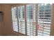 Interior view of multi-pane windows with white shutters to enhance privacy at 161 Brush Creek Ct, Stockbridge, GA 30281