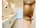 Bathroom featuring tiled shower, glass door, double vanity and lighting at 1995 Catnap Ct, Chamblee, GA 30341