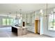 Spacious kitchen with white cabinets, a center island, and stainless steel appliances at 1995 Catnap Ct, Chamblee, GA 30341